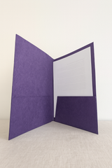 Interior view of a handmade Lokta folder showing dual purple paper pockets designed to hold A4 or letter-size documents.