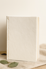 Interior view of A5 Lokta notebook showing 80 plain, eco-friendly handmade paper sheets