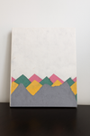 Handmade Lokta paper notebook with multicolor mountain-inspired design on natural white background